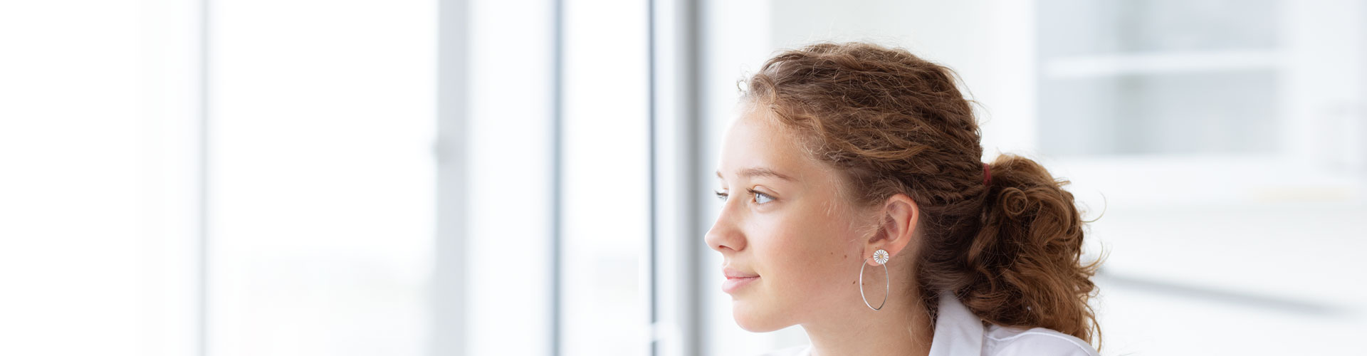 Teen wearing Opn play hearing aids