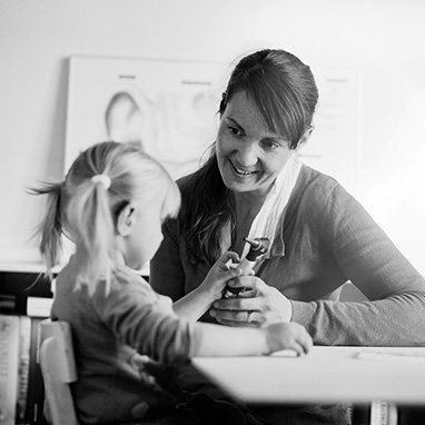 woman talking to a young girl