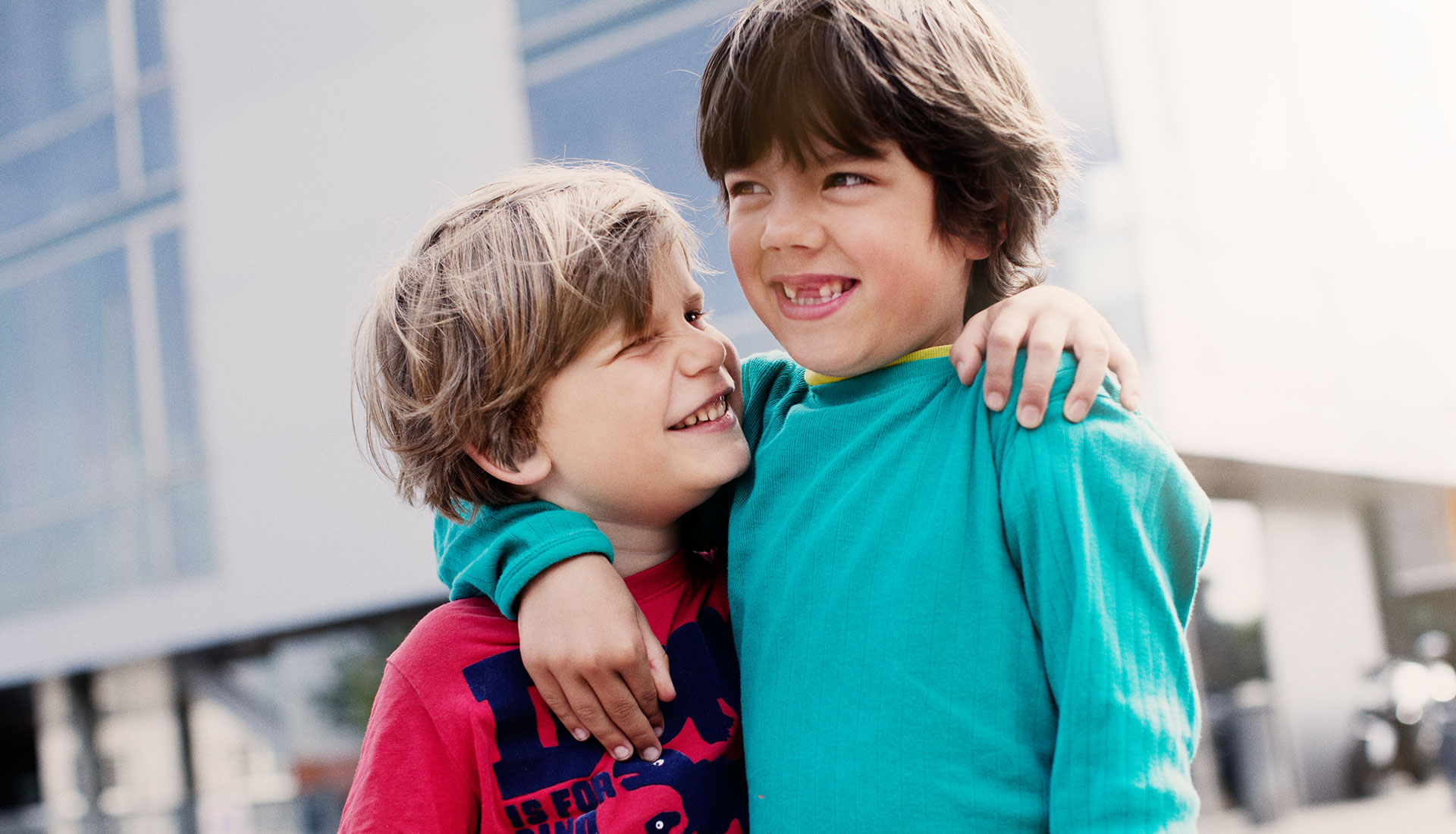 young boys hugging