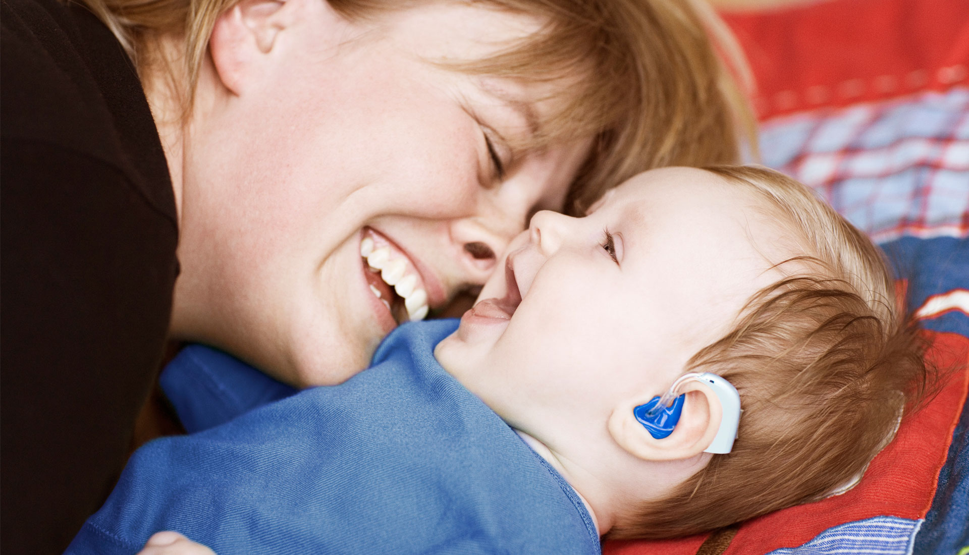 woman hugging baby